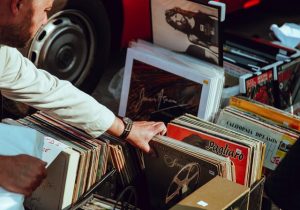 person sorting vinyls
