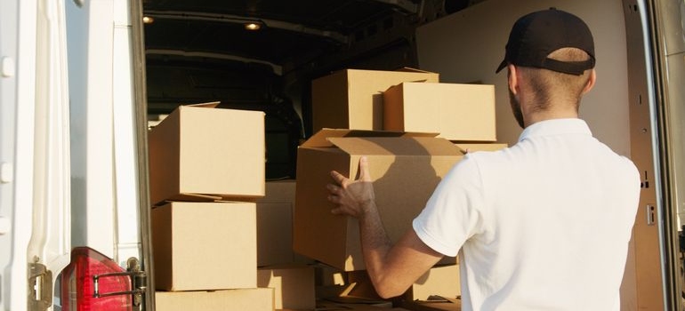 a man loading a truck wondering how to thank your movers