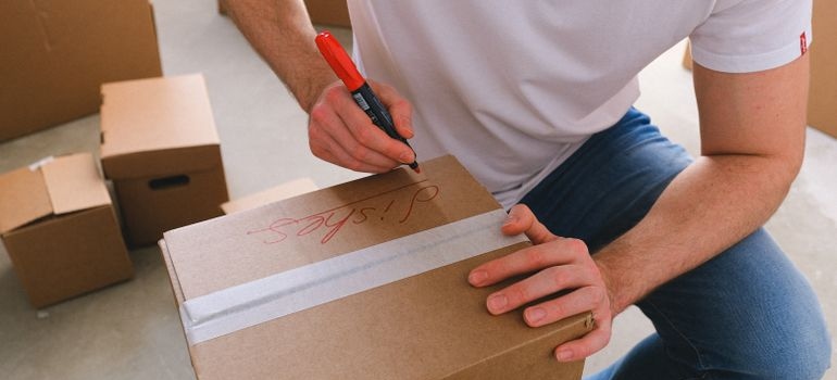 a man packing a box