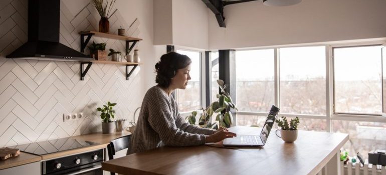 Woman researching different kinds of moving estimates.