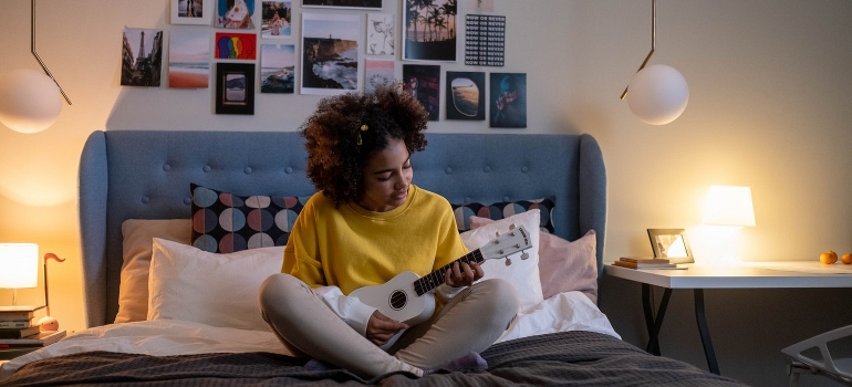 Teenage girl sitting on the bed