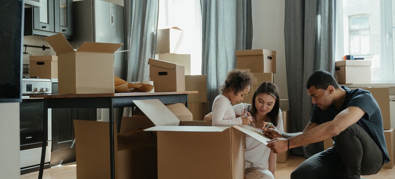 A happy family unpacking after the move