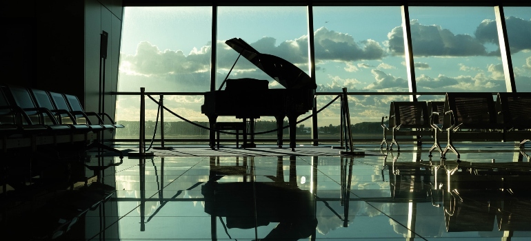 Silhouette of a grand piano ready for relocation