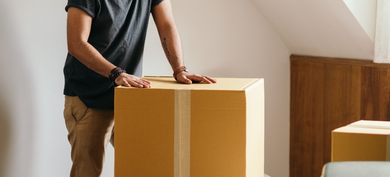 A single dad packing boxes for a move in Tennessee
