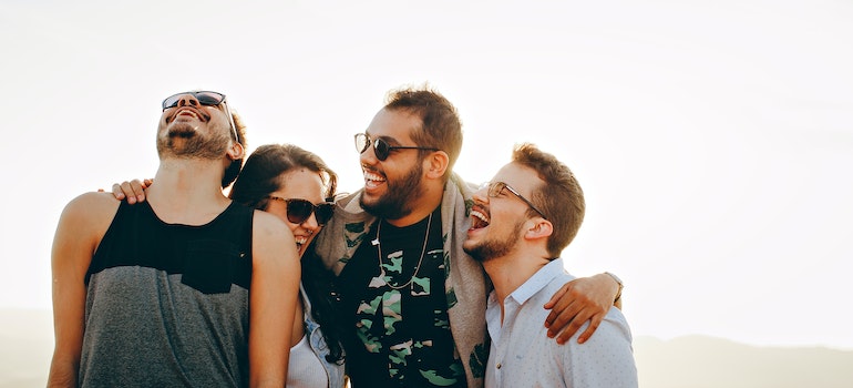 A group of friends laughing together outdoors