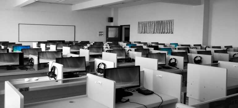 Empty office space with desks and computers ready for an IT equipment move