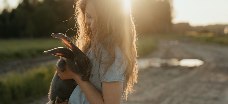 A girl with her pet rabbit