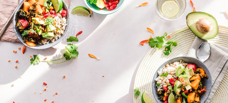 Two plated vegetable dishes on a dining table