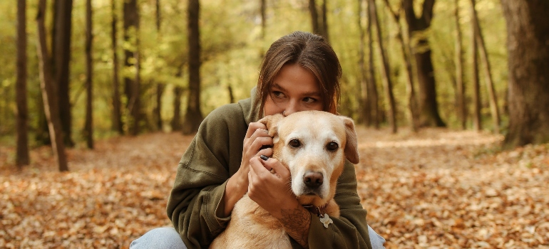 Woman huging her dog in one of the best places in Tennessee for ex-New Yorkers