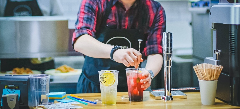 A barista making drinks in one of the best TN cities for job seekers