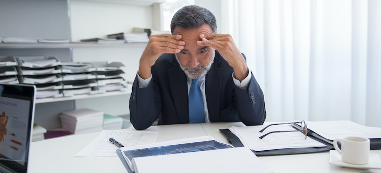 A stressed man weighing the reasons people are leaving Memphis