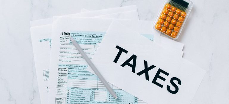 Property tax papers and a pencil on a table, a reminder of Memphis city and Shelby County tax bills