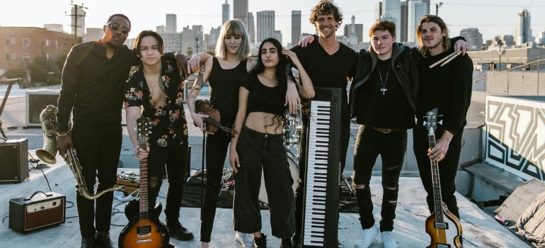 A group of musicians posing with their instruments