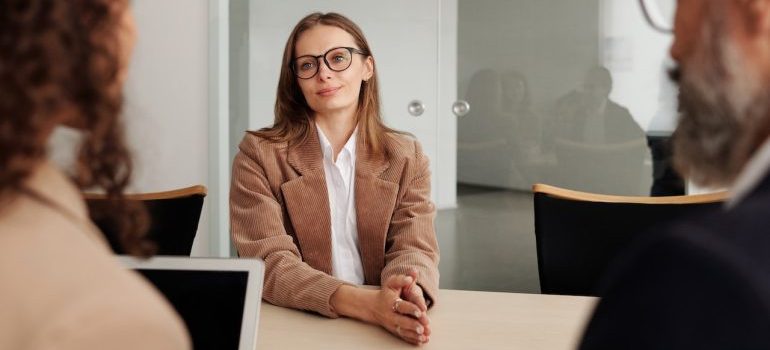 woman in sitting beside table