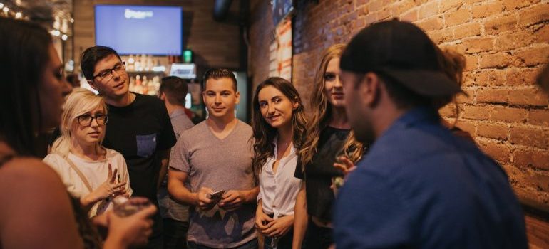 group of people talking about the best Colorado cities for young adults