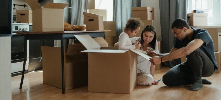 A family talking at home while choosing between the Lakewood area vs Colorado Springs