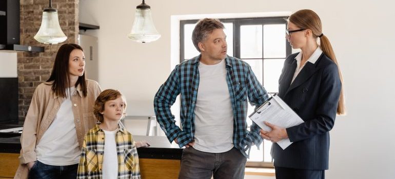 a family with real estate agent