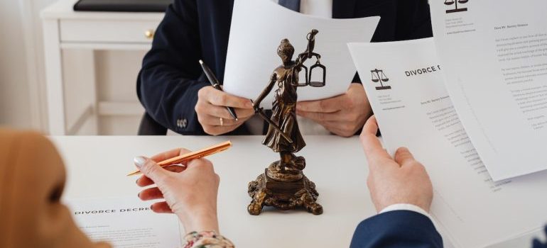 lawyer and a couple with divorce papers