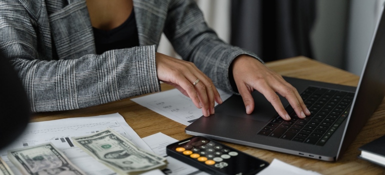 Woman researching the Mississippi cost of living before a move