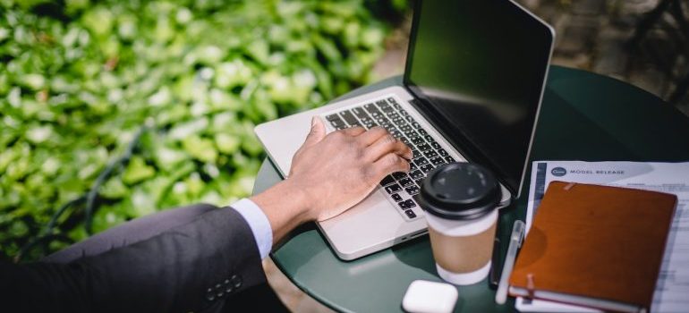 A digital nomad working on a laptop at home in Germantown, TN