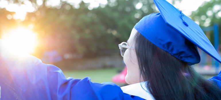 Girl in a blue graduation gown