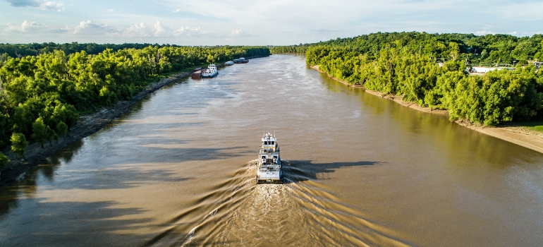 White boat on the river during the daytime