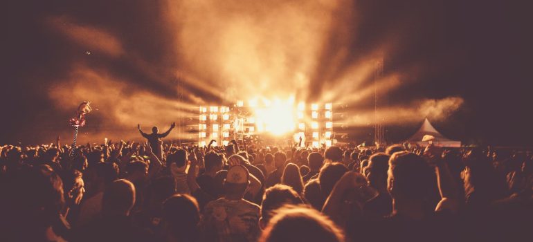 Crowd watching a band on stage at a concert