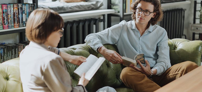 Two people discussing a book they're reading