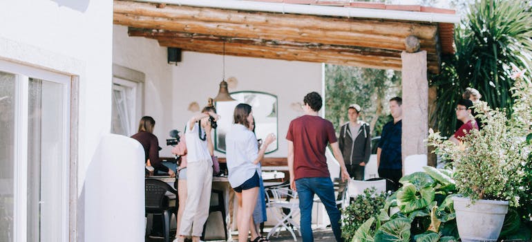 Friends talking and laughing at a house get-together