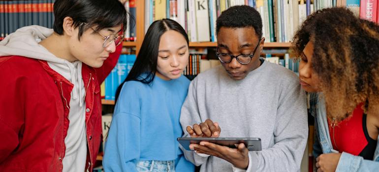 University students studying together at a library table
