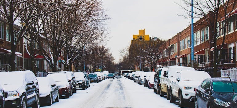A snow-covered residential street in winter