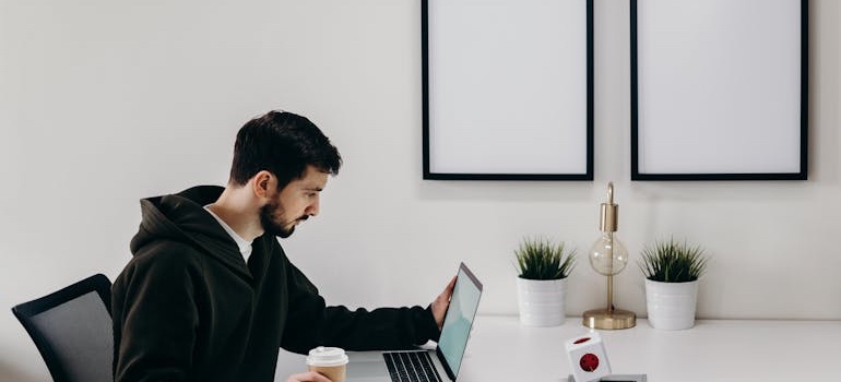 A person searching for apartments online before moving out of your family home in Denver for the first time