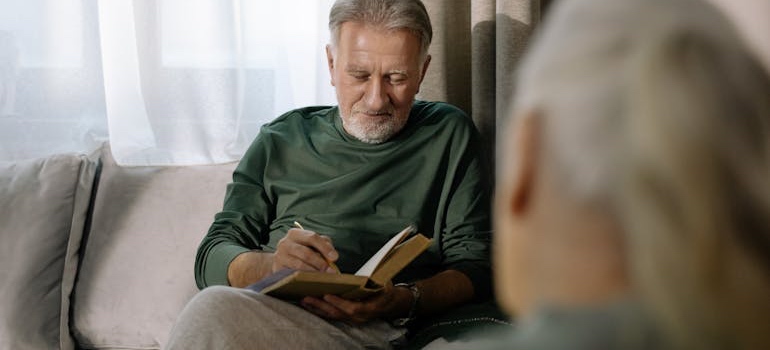 An empty nester reading a book at home