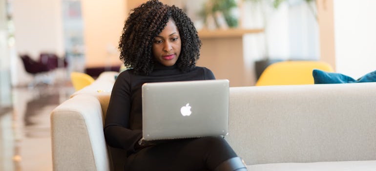 A person using a laptop to research Mississippi cities for real estate investors