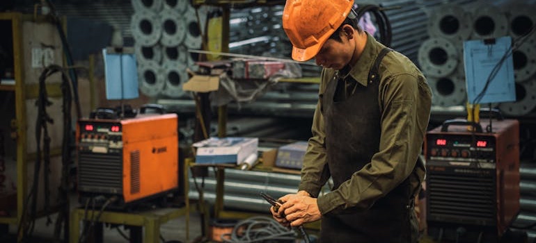 A man working with machinery in a factory
