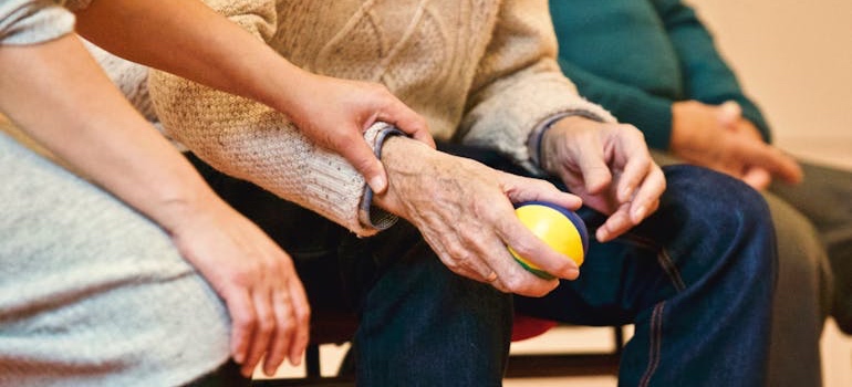 A healthcare worker helping someone