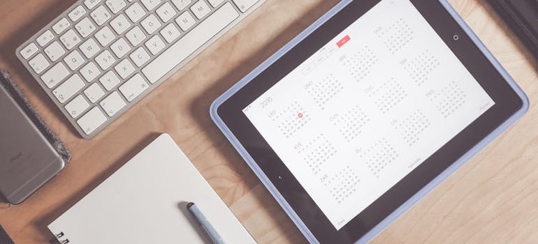 A tablet showing a calendar app used to plan a home purchase