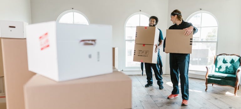 A moving crew carrying boxes