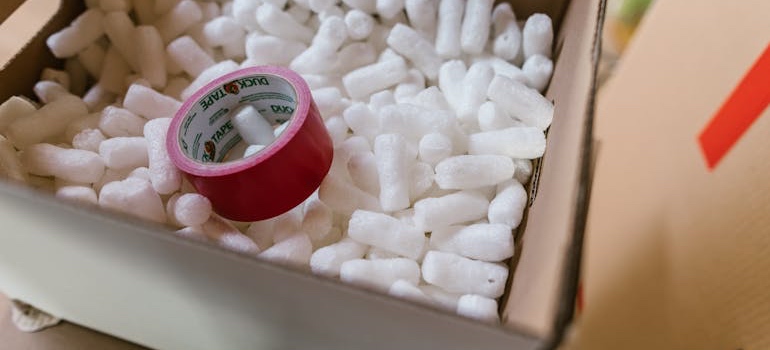 An open box filled with packing peanuts for moving your computer across state lines