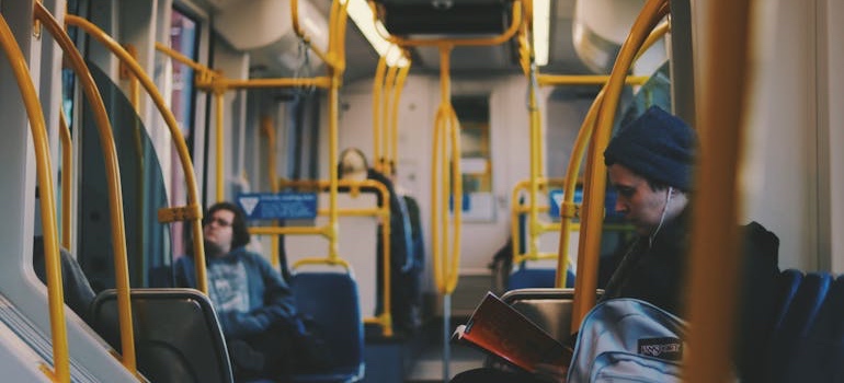 The inside of a city bus with empty seats