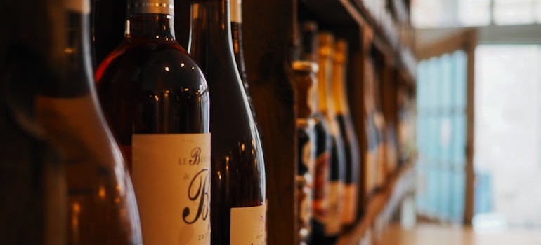 Bottles of wine lined up on a shelf