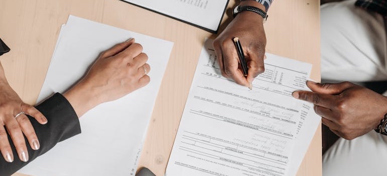 People signing a contract