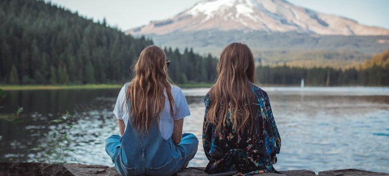 People relaxing at Evergreen Lake, a natural spot to visit in Colorado