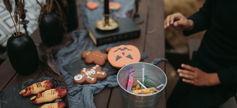 A table with Halloween decorations and candy