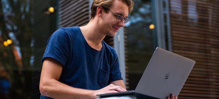 A person using a laptop to search for jobs in Colorado cities