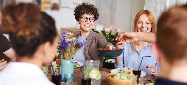 Friends sharing a meal at a restaurant table