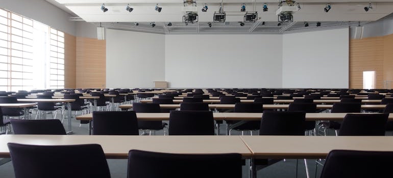 Empty university lecture hall with rows of seats