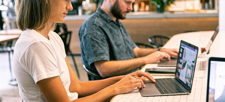 Person using a laptop to research the top investment hotspots in Colorado
