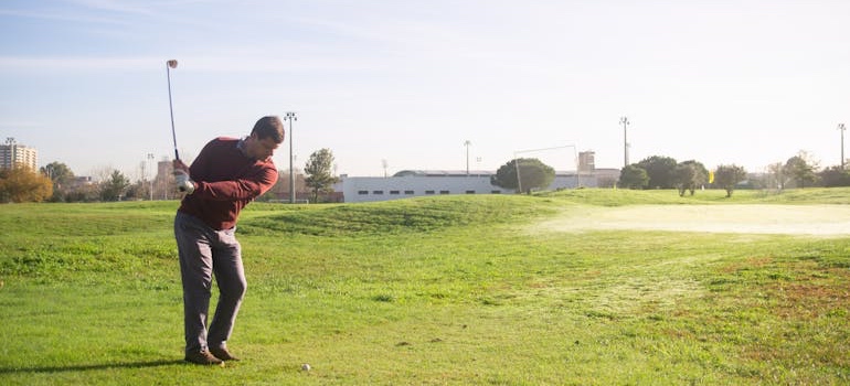 People playing golf on a green golf course