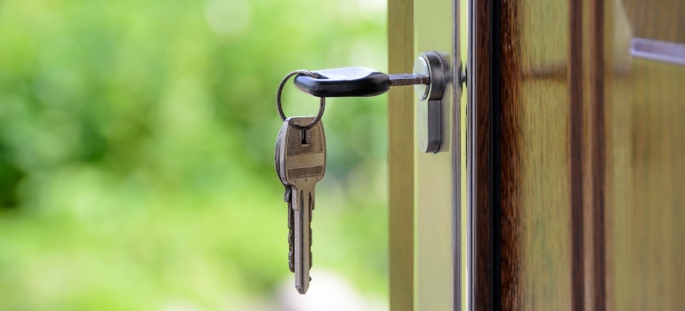 A key in the door lock of a new home after moving